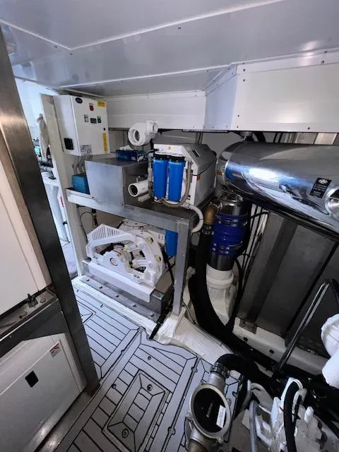 Slide: The Image of Engine room of 2016 Prestige 750 yacht with mechanical equipment and piping. - 38