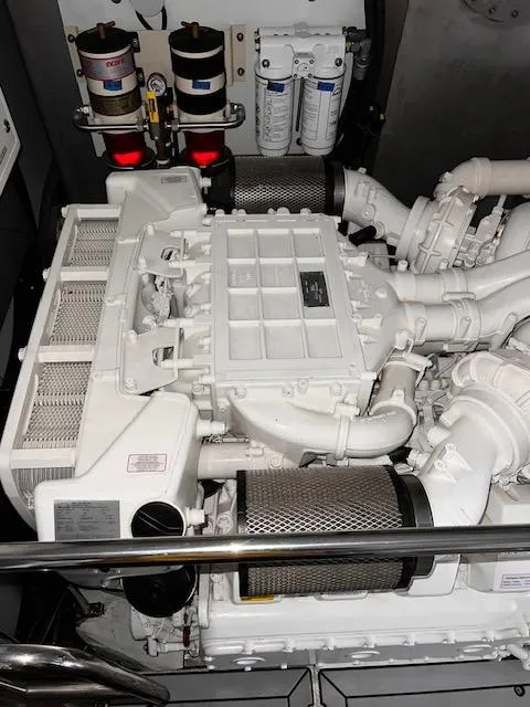 Slide: The Image of Engine room of a 2016 Prestige 750 yacht, showcasing mechanical components. - 42
