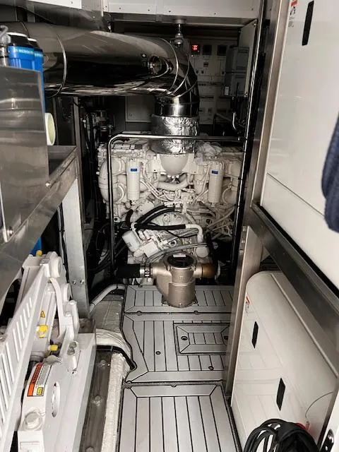 Slide: The Image of Engine room of a 2016 Prestige 750 yacht, showcasing machinery and components. - 43