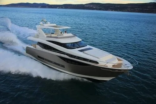 Slide: The Image of Luxury 2016 Prestige 750 yacht cruising on open water. - 5
