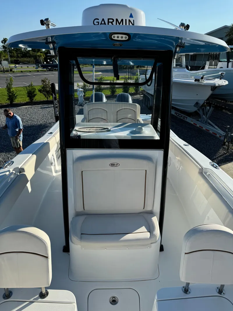Slide: The Image of 2020 Sea Hunt Gamefish 25 boat with Garmin equipment, docked in a marina. - 10