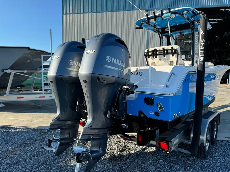 Slide: The Image of 2020 Sea Hunt Gamefish 25 boat with dual Yamaha 150 engines on a trailer. - 5