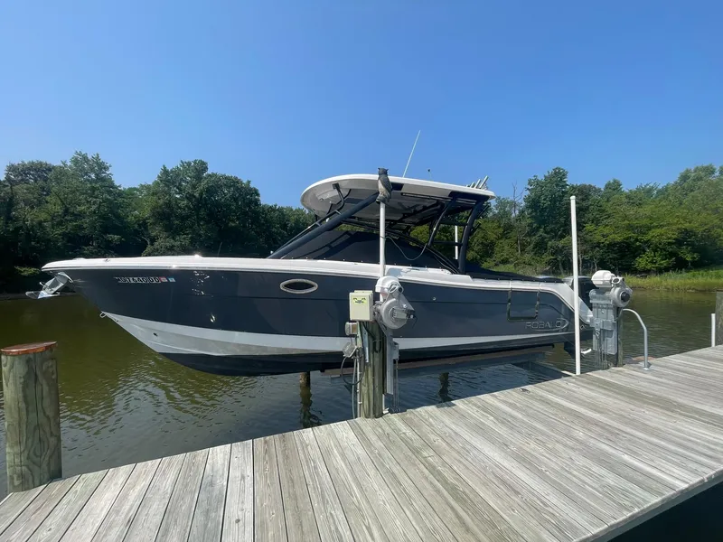 The Image of 2020 Robalo R317 Dual Console boat docked on a sunny day. - 0