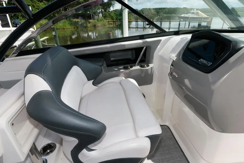 Slide: The Image of 2020 Robalo R317 Dual Console boat interior with sleek seating and modern dashboard. - 10