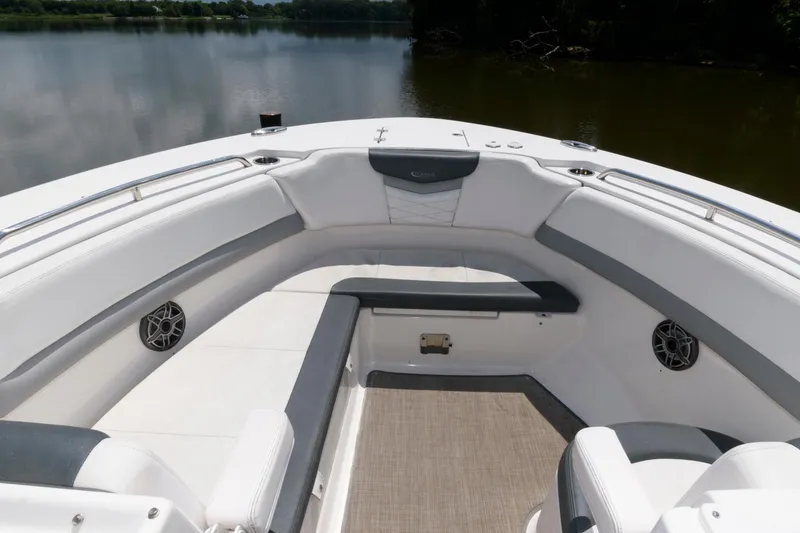 Slide: The Image of 2020 Robalo R317 Dual Console boat interior with spacious seating and scenic water view. - 11