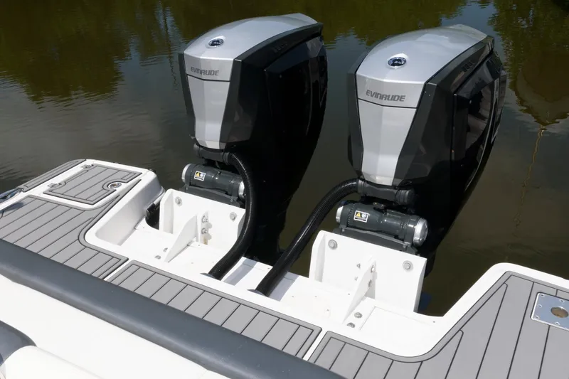 Slide: The Image of 2020 Robalo R317 Dual Console with twin Evinrude outboard engines. - 14