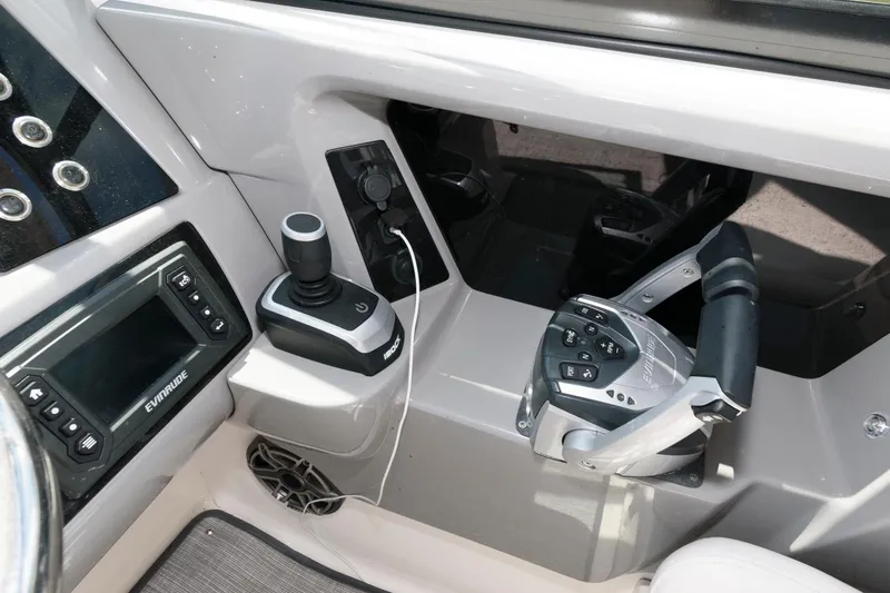 Slide: The Image of 2020 Robalo R317 Dual Console boat cockpit with controls and navigation system. - 8
