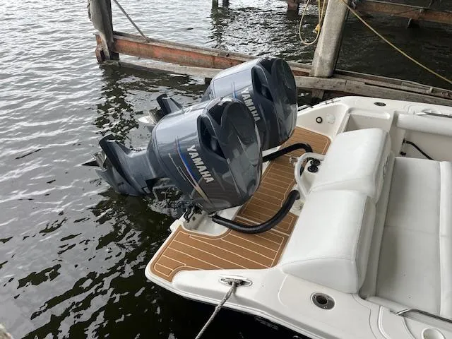 Slide: The Image of 2004 Marlago FS35 boat with twin Yamaha outboard engines docked on water. - 15