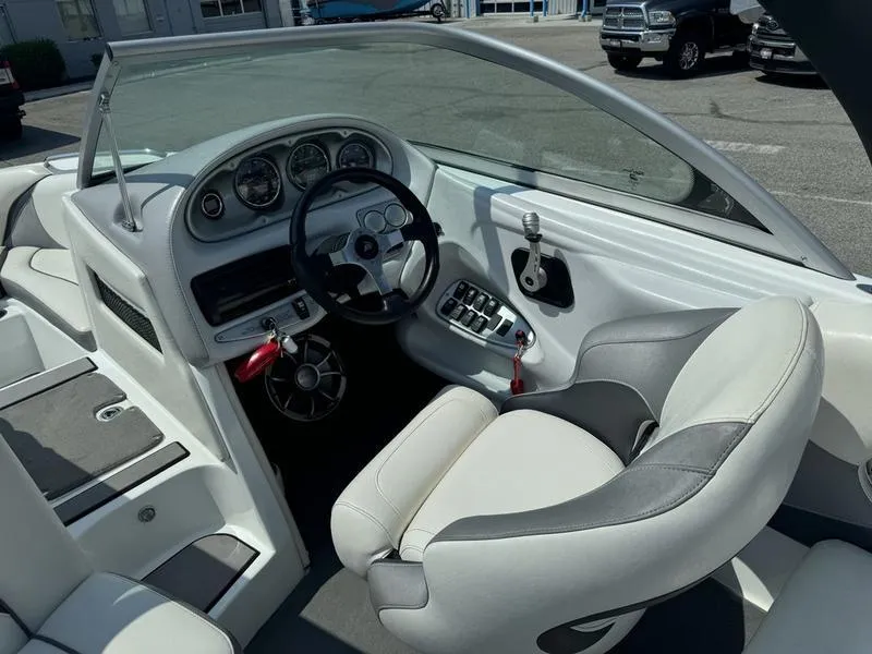 Slide: The Image of 2012 Century Avalanche boat interior with steering wheel and dashboard controls. - 10