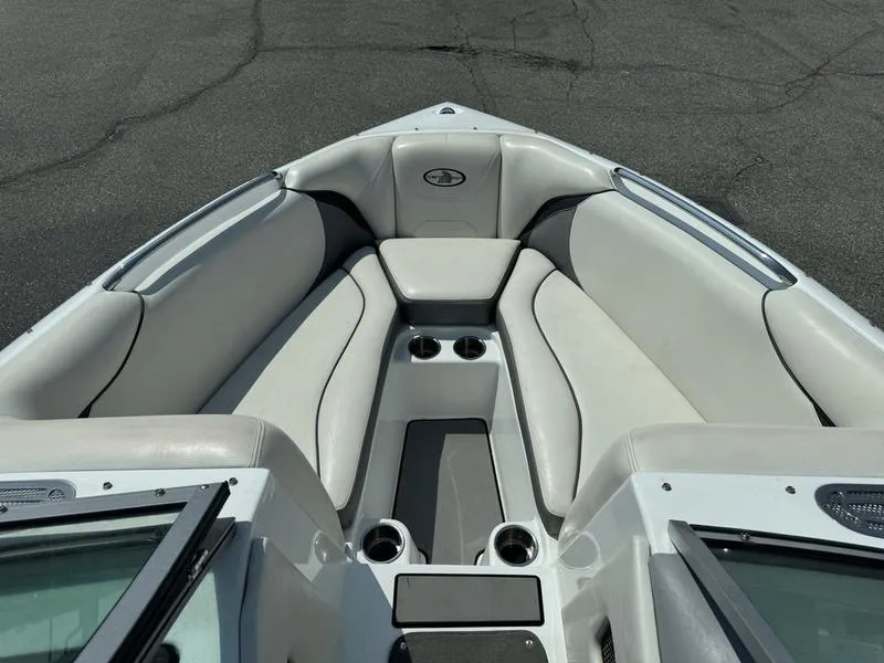 Slide: The Image of 2012 Century Avalanche boat interior with cushioned seating and cup holders. - 11