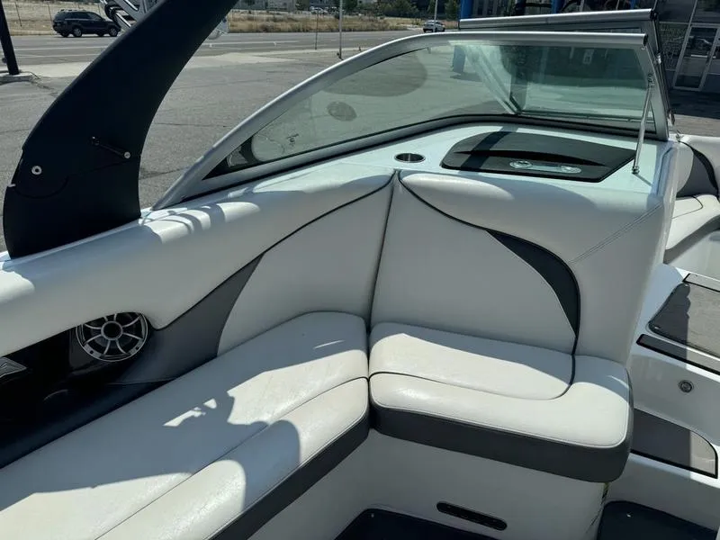 Slide: The Image of 2012 Century Avalanche boat interior with white leather seating and modern design. - 12