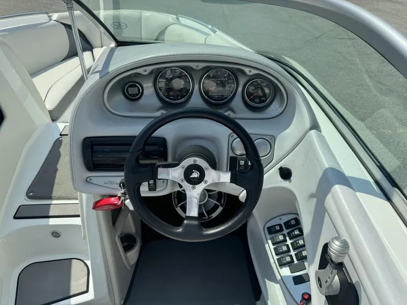 Slide: The Image of 2012 Century Avalanche boat dashboard with steering wheel and control panel. - 13