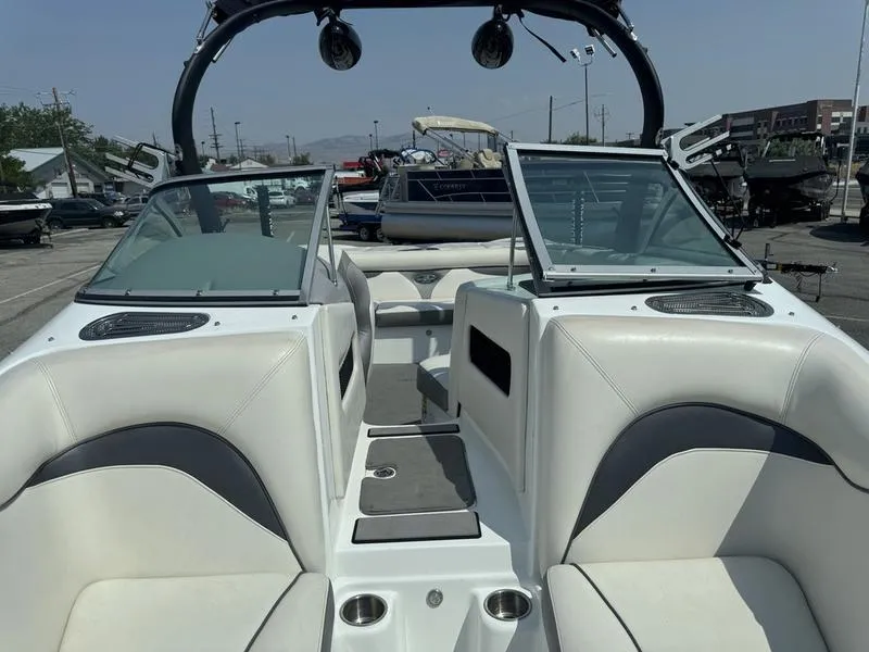 Slide: The Image of 2012 Century Avalanche boat interior with white seating and dual windshields. - 14