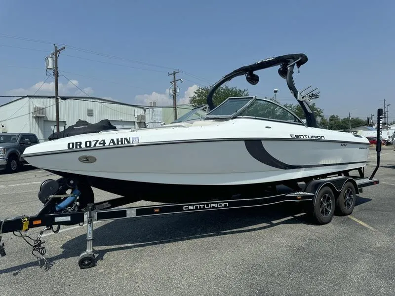 Slide: The Image of 2012 Century Avalanche boat on trailer in parking lot. - 3
