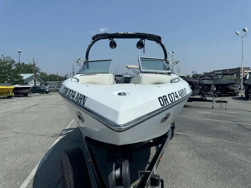 Slide: The Image of 2012 Century Avalanche boat on trailer in parking lot. - 4