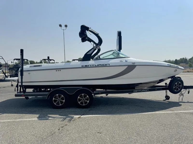 Slide: The Image of 2012 Century Avalanche boat on trailer in parking lot. - 5