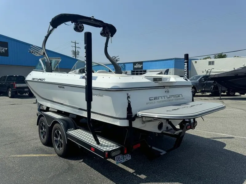Slide: The Image of 2012 Century Avalanche boat on trailer in parking lot, rear view. - 6
