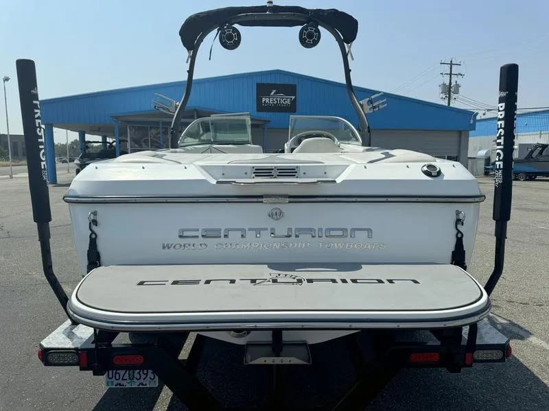 Slide: The Image of 2012 Centurion Avalanche boat at dealership, rear view with wakeboard tower. - 7