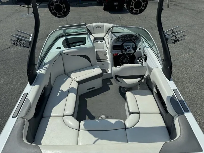 Slide: The Image of 2012 Century Avalanche boat interior with white seating and modern dashboard. - 9