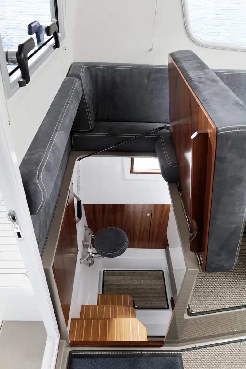 Slide: The Image of Interior of 2024 Sargo 31 boat with modern seating and wooden accents. - 6