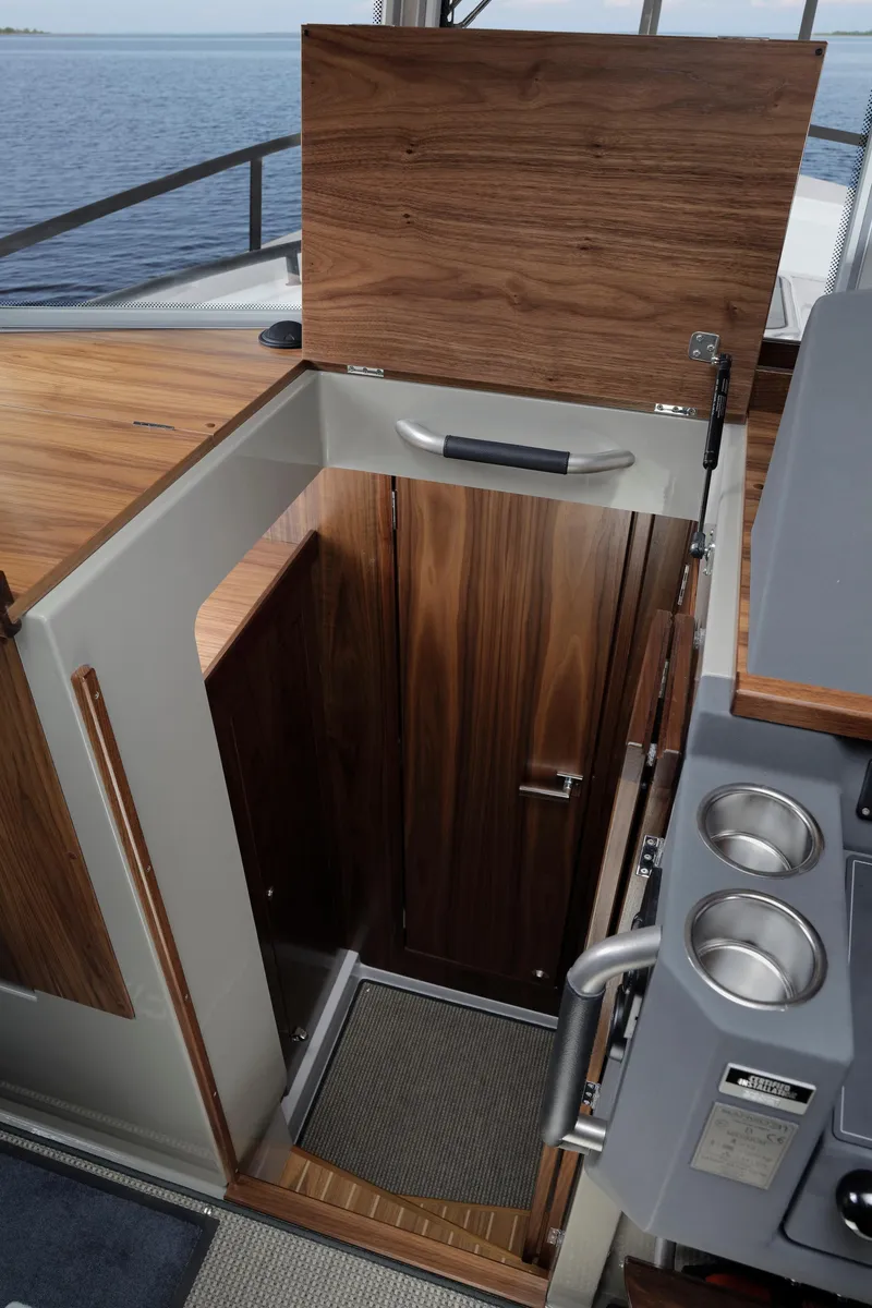 Slide: The Image of 2024 Sargo 31 boat interior with wooden cabinetry and modern design. - 7