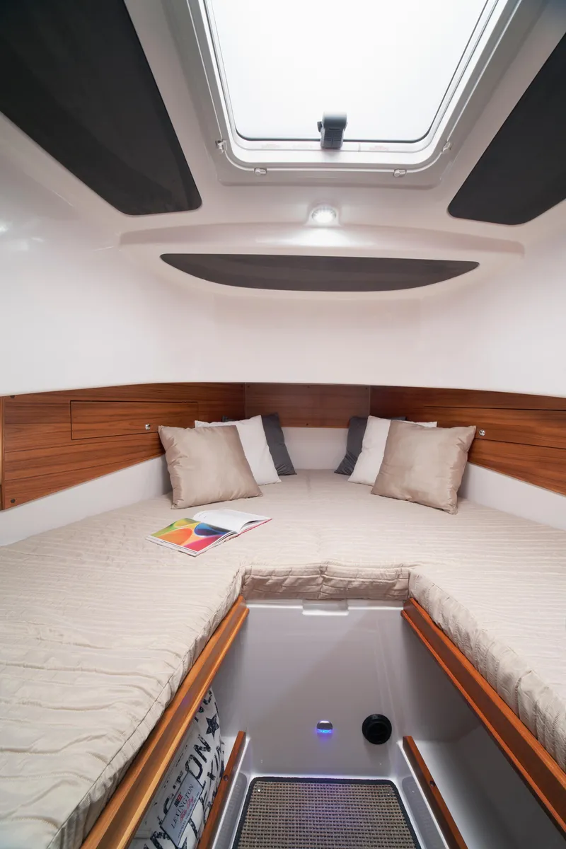 Slide: The Image of Interior of 2024 Sargo 31 boat cabin with cozy bedding and skylight. - 9