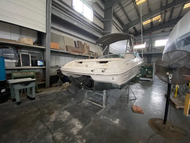 Slide: The Image of 2005 Sea Ray 200 Sport boat in a storage facility. - 1