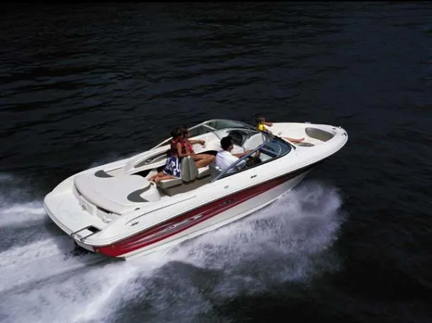 Slide: The Image of 2005 Sea Ray 200 Sport boat cruising on water with passengers. - 10