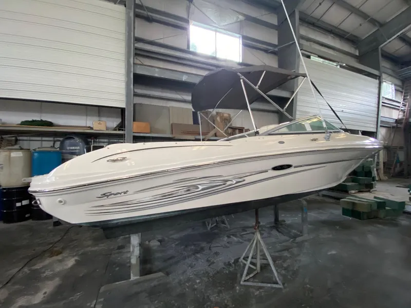 Slide: The Image of 2005 Sea Ray 200 Sport boat in a storage facility. - 2
