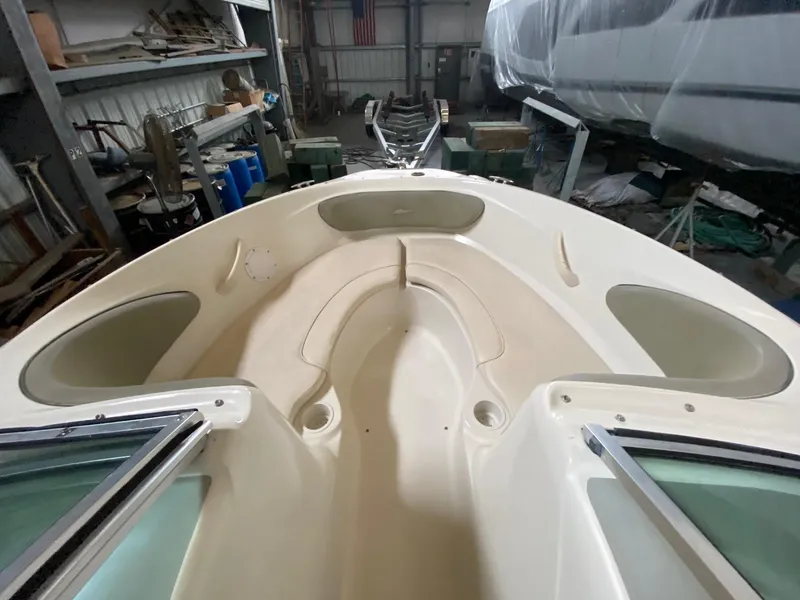 Slide: The Image of 2005 Sea Ray 200 Sport boat interior in storage facility. - 6