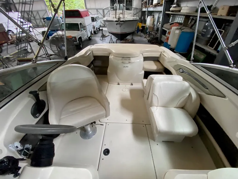 Slide: The Image of Interior of a 2005 Sea Ray 200 Sport boat in a storage facility. - 7