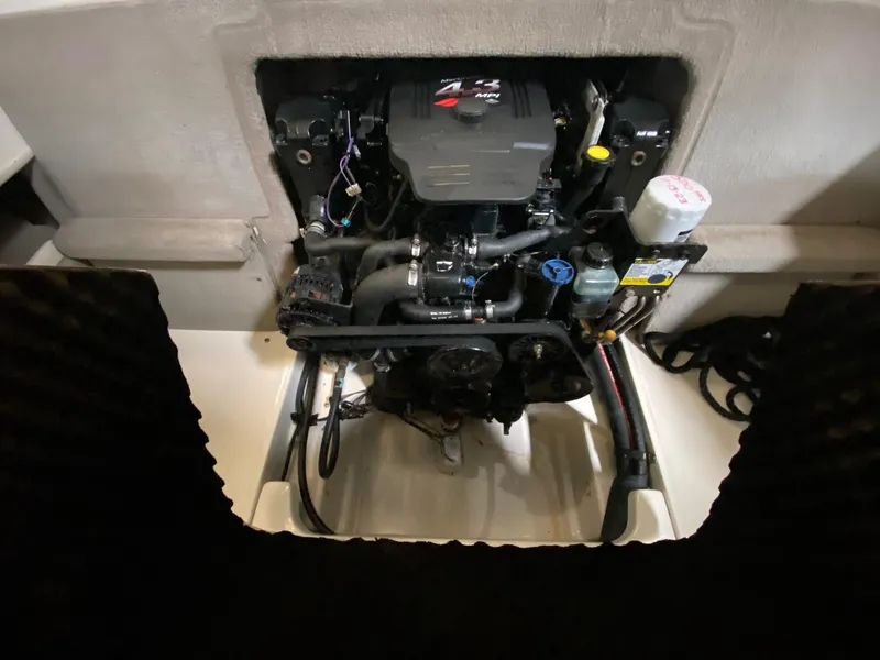 Slide: The Image of Engine compartment of a 2005 Sea Ray 200 Sport boat, showcasing the motor. - 8