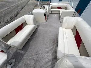 Slide: The Image of 2006 Crest Super Sport boat interior with white and red seating arrangement. - 11