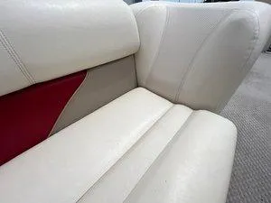 Slide: The Image of Cream and red upholstery on a 2006 Crest Super Sport boat seat. - 20
