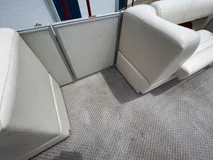 Slide: The Image of 2006 Crest Super Sport boat interior with white seating and carpeted floor. - 22
