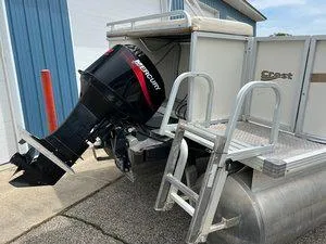 Slide: The Image of 2006 Crest Super Sport pontoon boat with Mercury outboard motor and boarding ladder. - 5