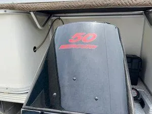 Slide: The Image of Outboard motor on a 2006 Crest Super Sport boat, featuring a 50 Mercury engine. - 6