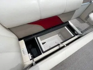 Slide: The Image of 2006 Crest Super Sport boat seat with built-in storage compartment, featuring white upholstery. - 8