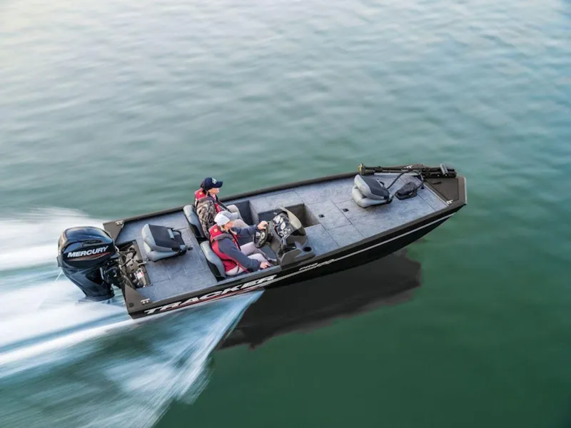 The Image of 2024 Tracker Pro 170 boat speeding on water with two passengers. - 1
