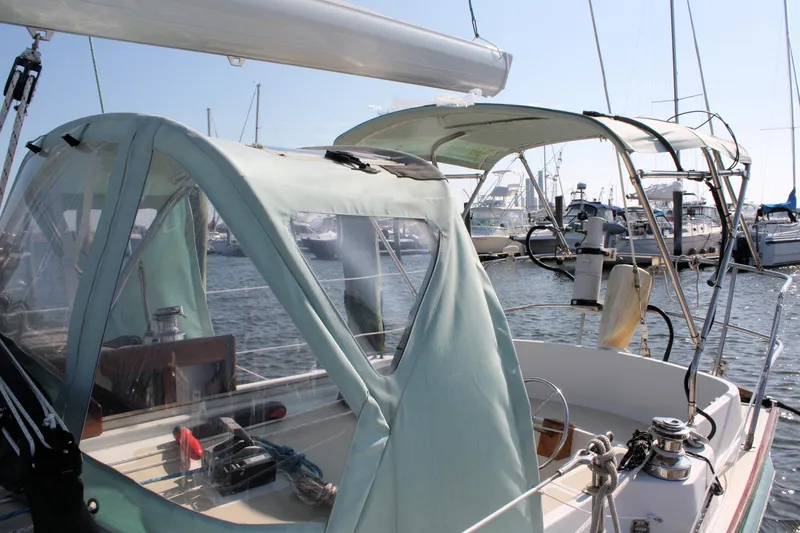 Slide: The Image of Sailboat with green canopy docked at marina, Morris Linda 1987 model. - 14