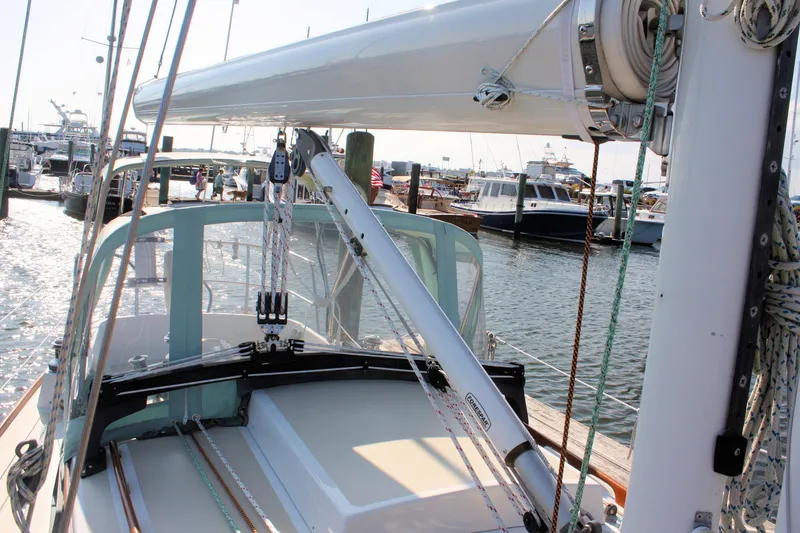 Slide: The Image of 1987 Morris Linda sailboat deck with rigging in a marina setting. - 15