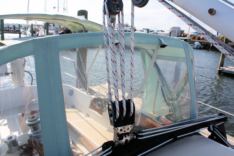 Slide: The Image of Sailboat cockpit with ropes and pulleys, Morris Linda 1987, docked at marina. - 16