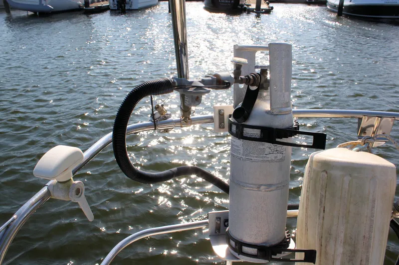 Slide: The Image of Boat deck with safety equipment, Morris Linda 1987, docked on sunny water. - 22