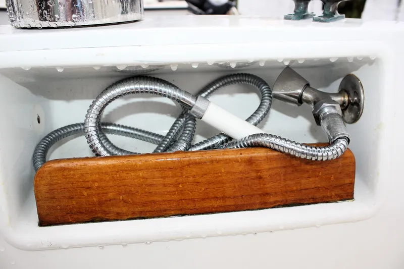 Slide: The Image of Coiled metal hose in a compartment of a 1987 Morris Linda boat. - 25