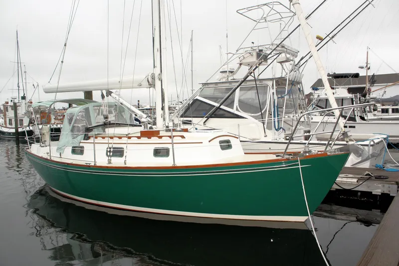 Slide: The Image of Green 1987 Morris Linda sailboat docked at a marina. - 3