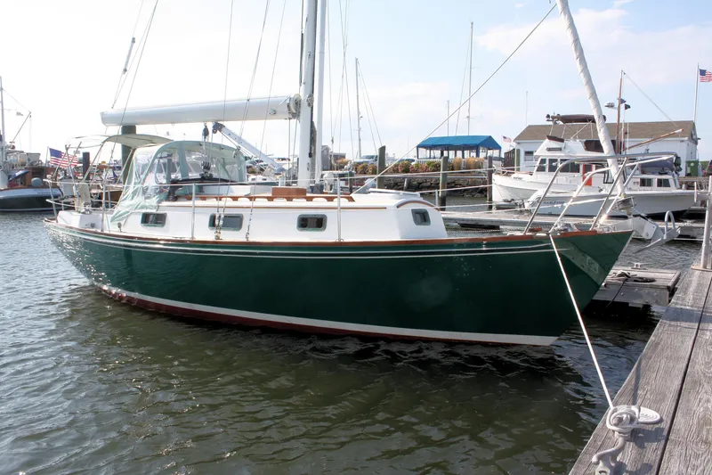 Slide: The Image of Sailboat docked at marina, Morris Linda 1987 model, green hull, clear sky. - 4