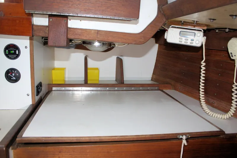 Slide: The Image of Interior of a 1987 Morris Linda boat with wooden cabinetry and communication equipment. - 46