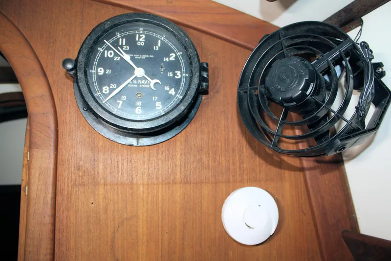 Slide: The Image of Vintage ship clock and fan on Morris Linda 1987 wooden interior. - 48