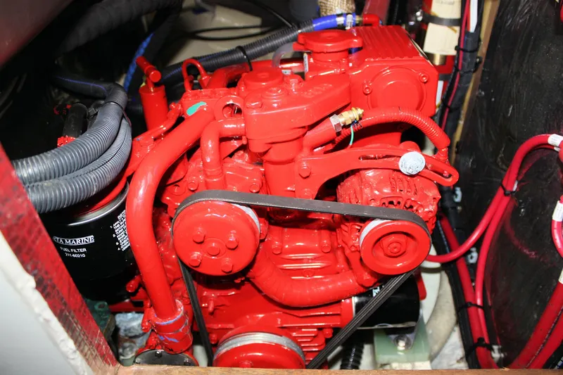 Slide: The Image of Red engine of a 1987 Morris Linda, featuring detailed components and wiring. - 50