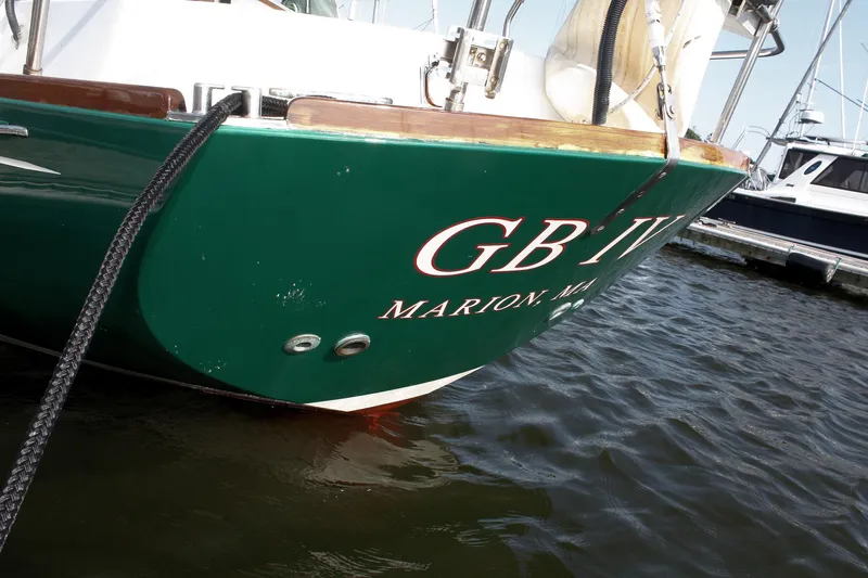 Slide: The Image of Green boat named "GB IV" docked in marina, Morris Linda 1987 model. - 8